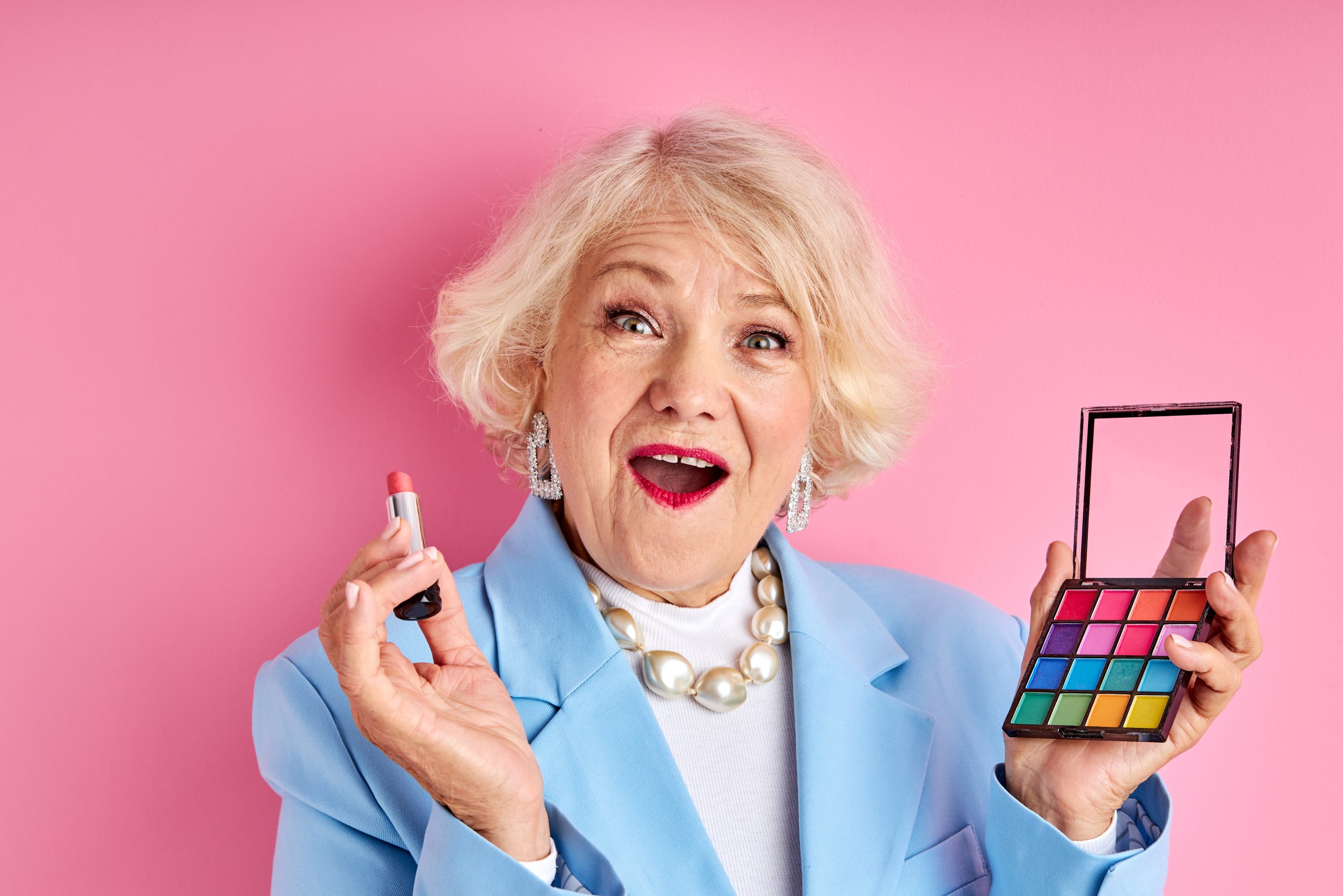 adorable excited mature lady applying new product cosmetics